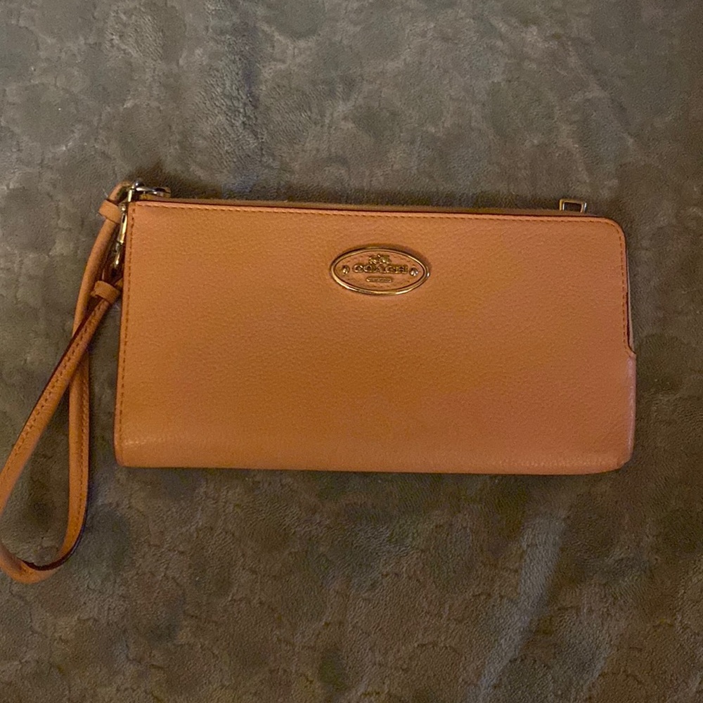 Vintage coach wallet with strap. Lots of packets. Love this wallet.